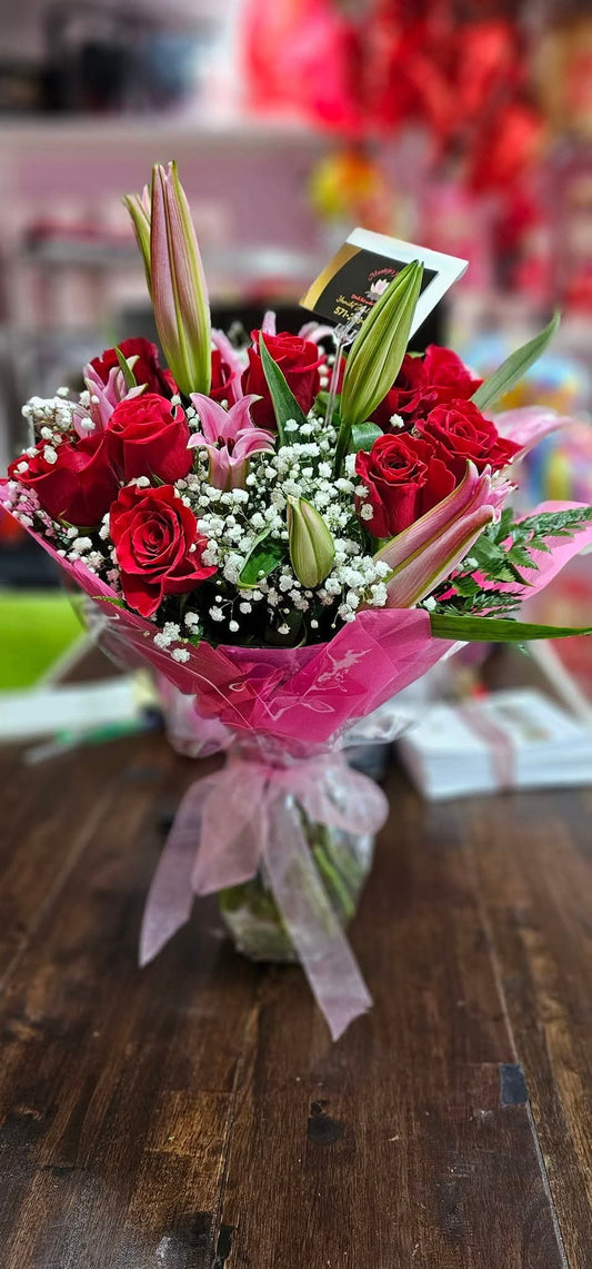 Arrangement of Lilies With Roses in a Glass Vase