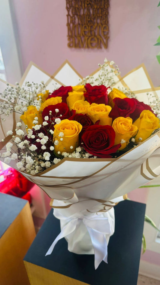 Bouquet of 25 Yellow and Red Roses in a Glass Vase