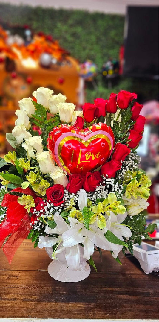 Heart-Style Arrangement With White and Red Roses